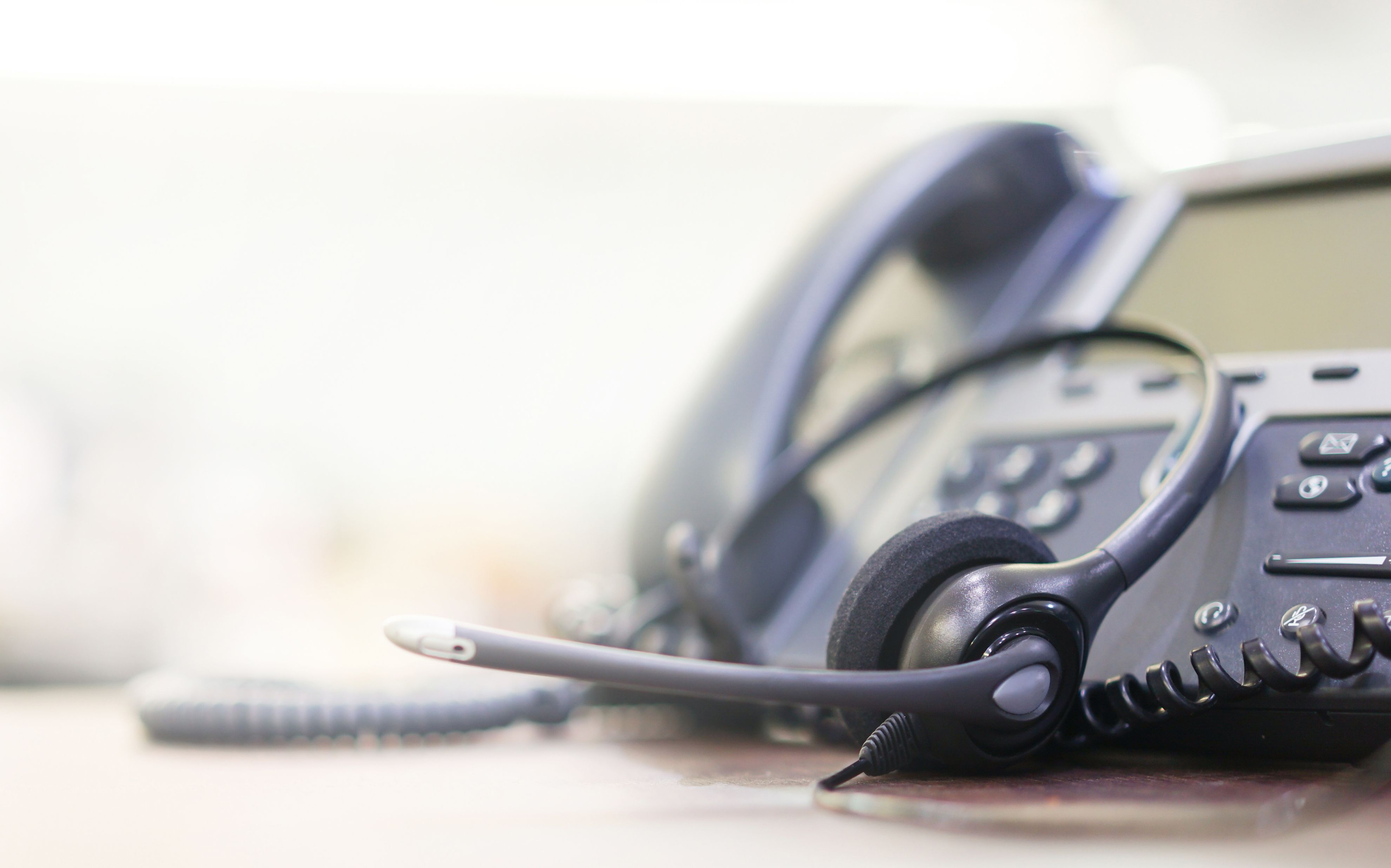 Corded telephone with headset attached